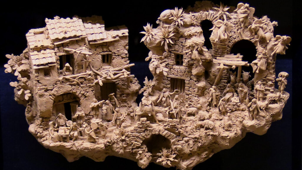 Dietro il presepe. L’evoluzione dell’arte presepiale napoletana dal secolo d’oro ai giorni nostri 1 Scena presepiale in terracotta che mostra l’architettura e la composizione dell’arte presepiale napoletana esposta nella mostra Dietro il presepe alla Certosa di San Martino.