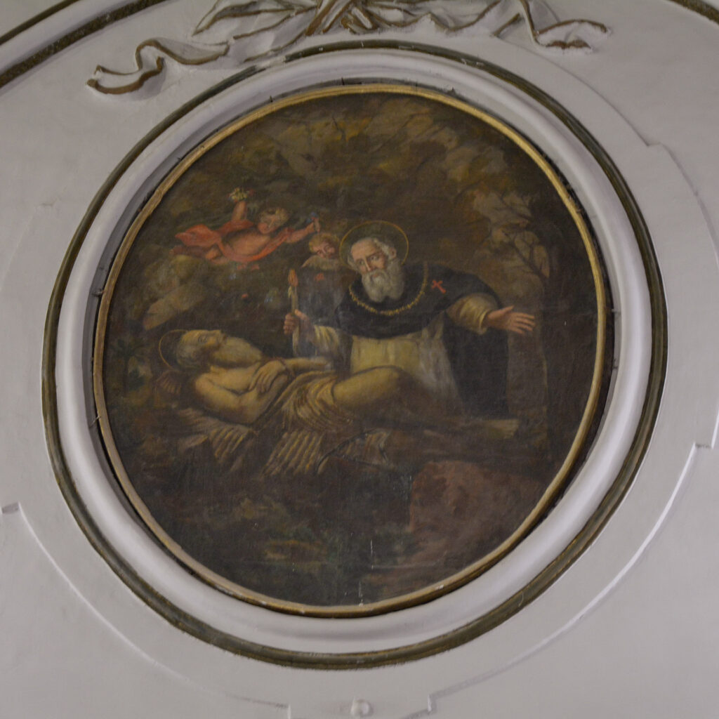 Tondo pittorico raffigurante probabilmente Sant’Antonio Abate, riconoscibile dal saio scuro e dal bastone a tau, mentre assiste San Paolo Eremita morente, immagine simbolica del culto del fuoco e del cippo di Sant’Antuono a Napoli