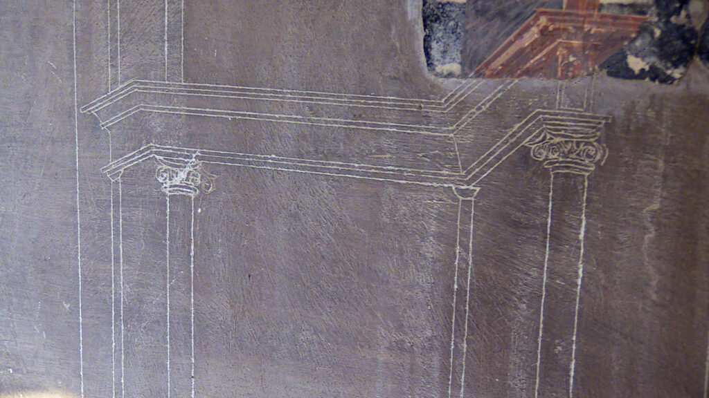 Ercolano graffito architettonico dove è possibile vedere le tracce originali del progetto di affresco
